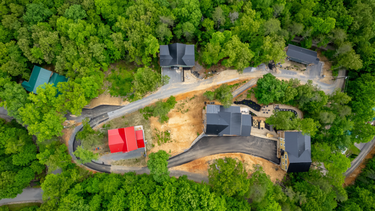 Aerial view of multiple private cabins surrounded by trees in Gatlinburg, TN.