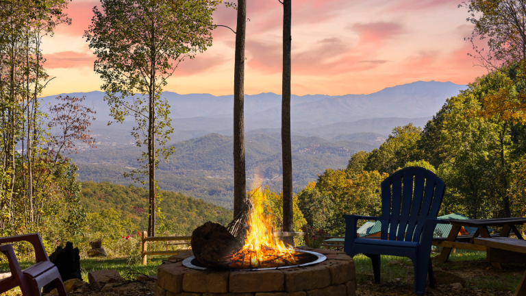 Outdoor fire pit surrounded by chairs with mountain views in the Smoky Mountains.