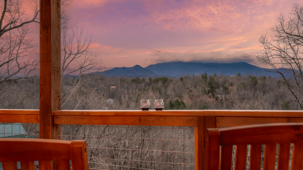 Deck overlooking mountains in Gatlinburg under a clear sky.