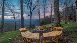 View of Smoky Mountains at dusk with scattered cabins.