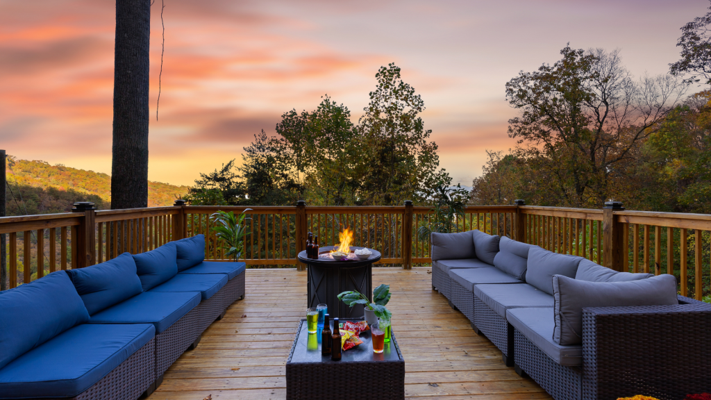 Outdoor deck with fire pit and views of the Smoky Mountains at sunset.